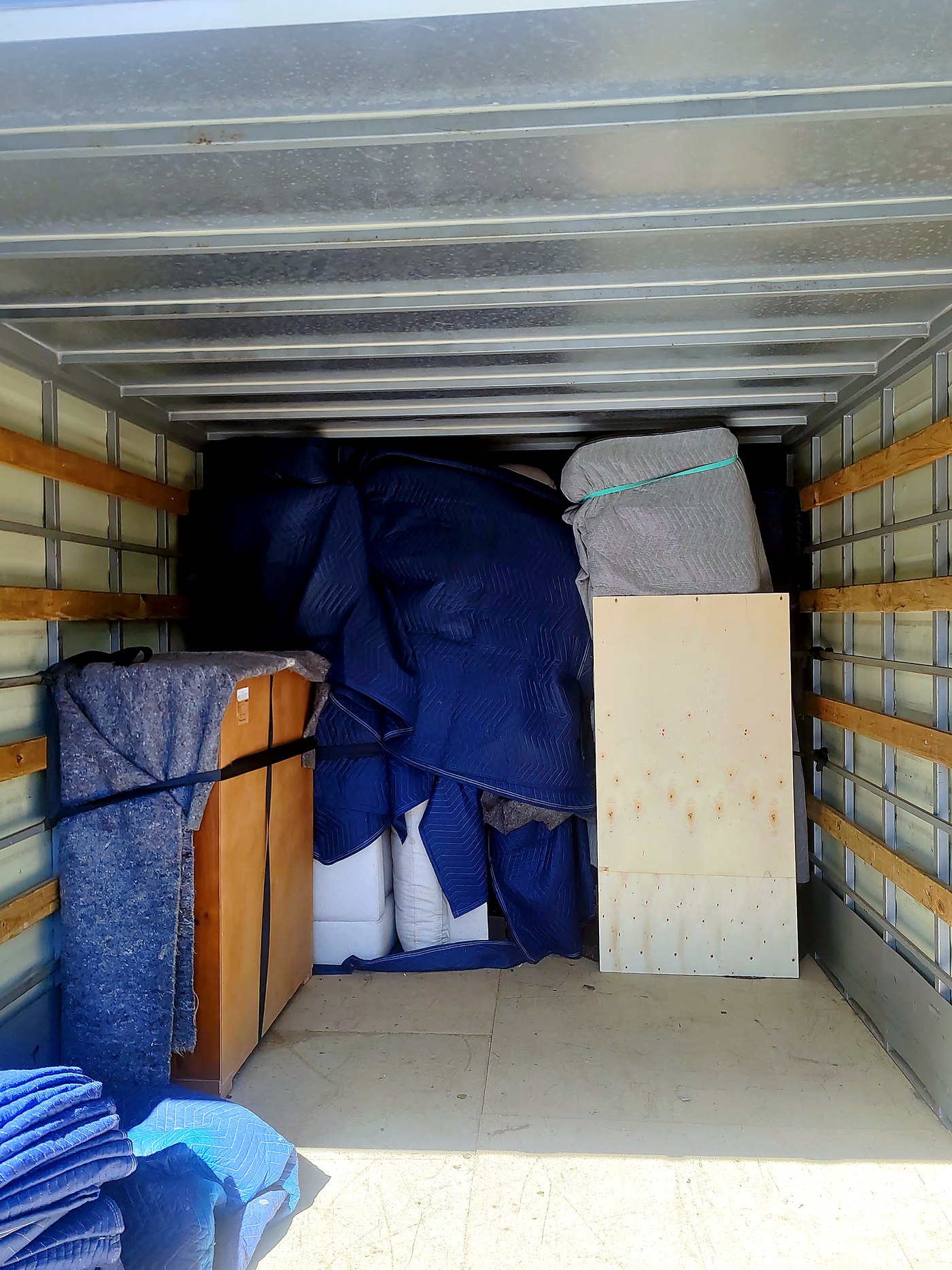 Furniture and boxes wrapped and packed securely inside the removals truck